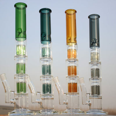Four colorful glass bongs featuring triple tree percolator in high-quality borosilicate glass
