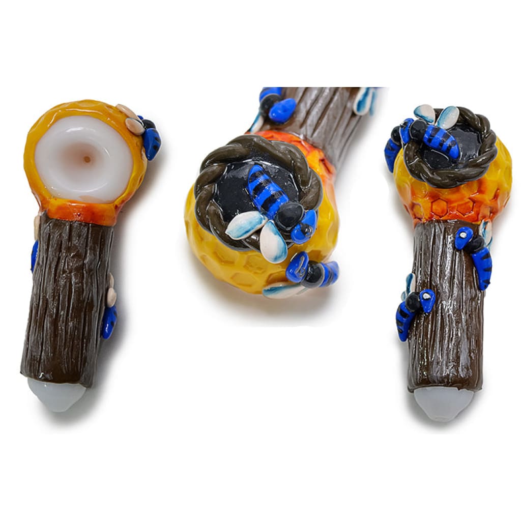 Clay honeycomb handpipe with bee design and glass core featuring colorful nature-themed art