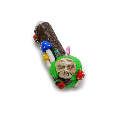 Whimsical skull-themed pipe with clay ladybug mushroom and ladybug mushroom crystals design