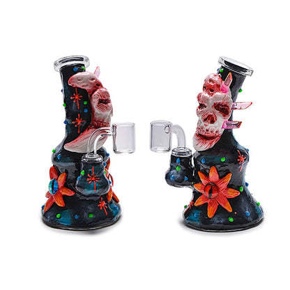 Colorful glass water pipes decorated with skull designs and floral patterns.