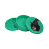 Green plastic herb grinder with witch design from Coleccionables De Picadores Para Aventuras