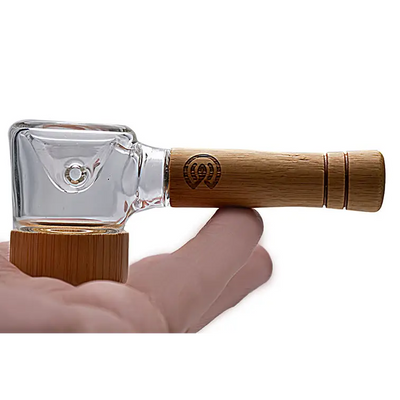 Glass and bamboo smoking pipe featured in Connect Natural Wood Spoon Pipe for eco-conscious collectors