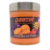 Scented candle jar labeled ’Deezer Signature Candles’ in Orange & Chili Pepper fragrance