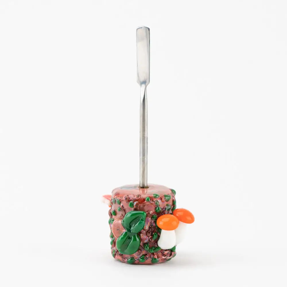 Empire Glassworks Bugs Life dab tool with pink glass pipe, green leaves, orange mushrooms