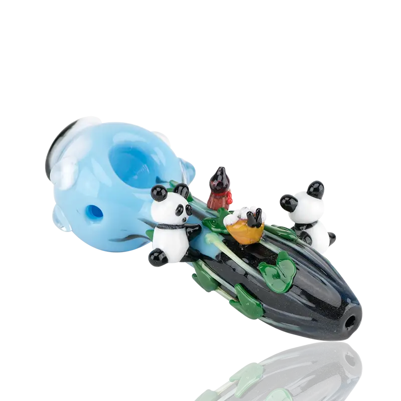 Empire Glassworks climbing pandas spoon pipe with translucent blue black glass and three panda figurines on green leafy design