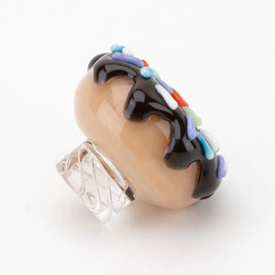 Empire Glassworks donut spinner carb cap with beige glass, chocolate drizzle, sprinkles