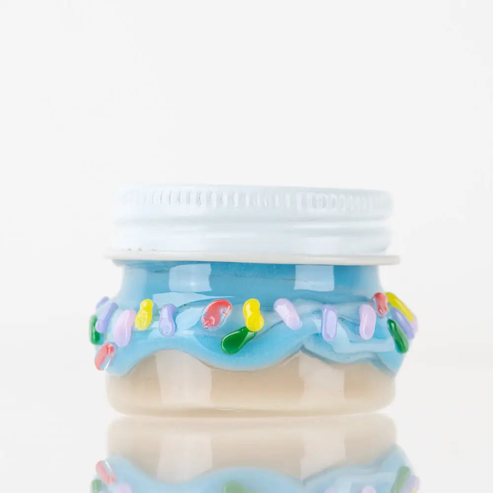Whimsical Empire Glassworks donut terp jar with blue cake design and sprinkles