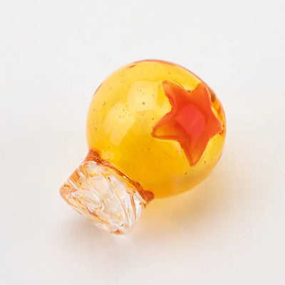 Empire Glassworks Dragon Sphere spinner cap carb cap in amber bottle