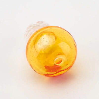 Translucent amber Empire Glassworks dragon sphere spinner carb cap bead