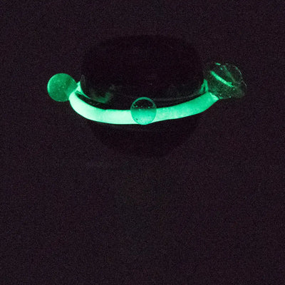 Empire Glassworks galactic 14mm glass bowl piece with glowing green silicone bracelet