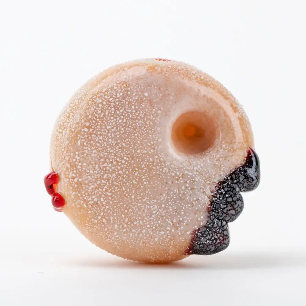Empire Glassworks Jelly Donut glass hand pipe with translucent peach speckled texture and blood-like accents