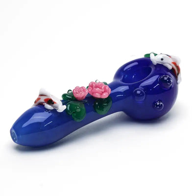 Empire Glassworks koi pond spoon pipe with cobalt blue glass, pink roses, green leaves, and white koi fish