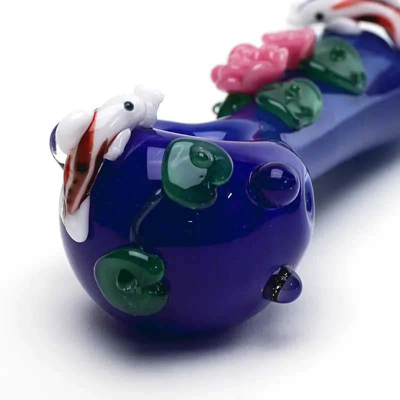 Empire Glassworks Koi Pond Spoon Pipe with vibrant purple glass and koi fish