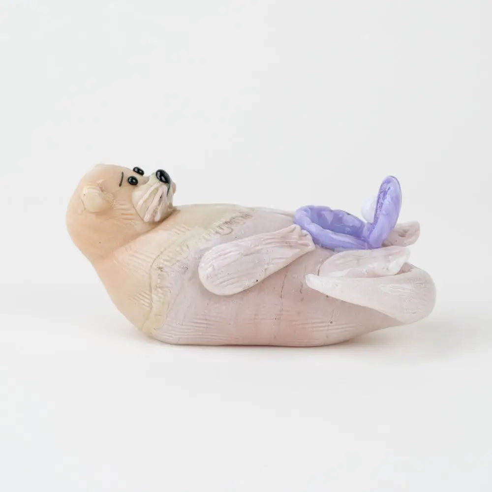 Empire Glassworks otter glass hand pipe with pink ceramic figurine and butterfly