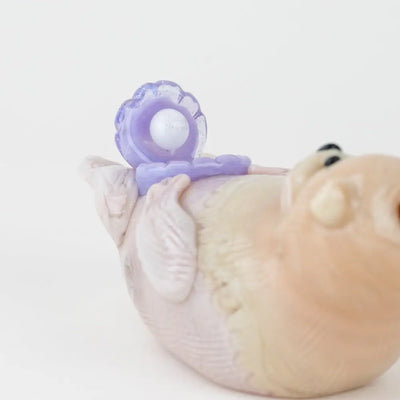 Empire Glassworks otter glass hand pipe with pink bird figurine and lavender pacifier