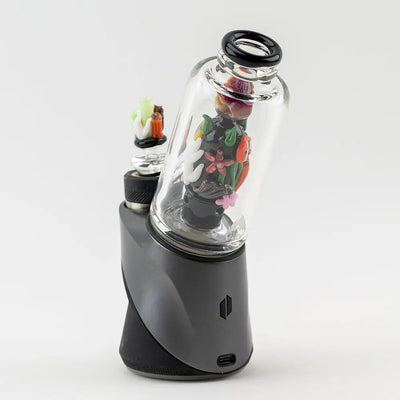 Sleek black Empire Glassworks Peak Attachment vaporizer with colorful Save the Seas glass dome art