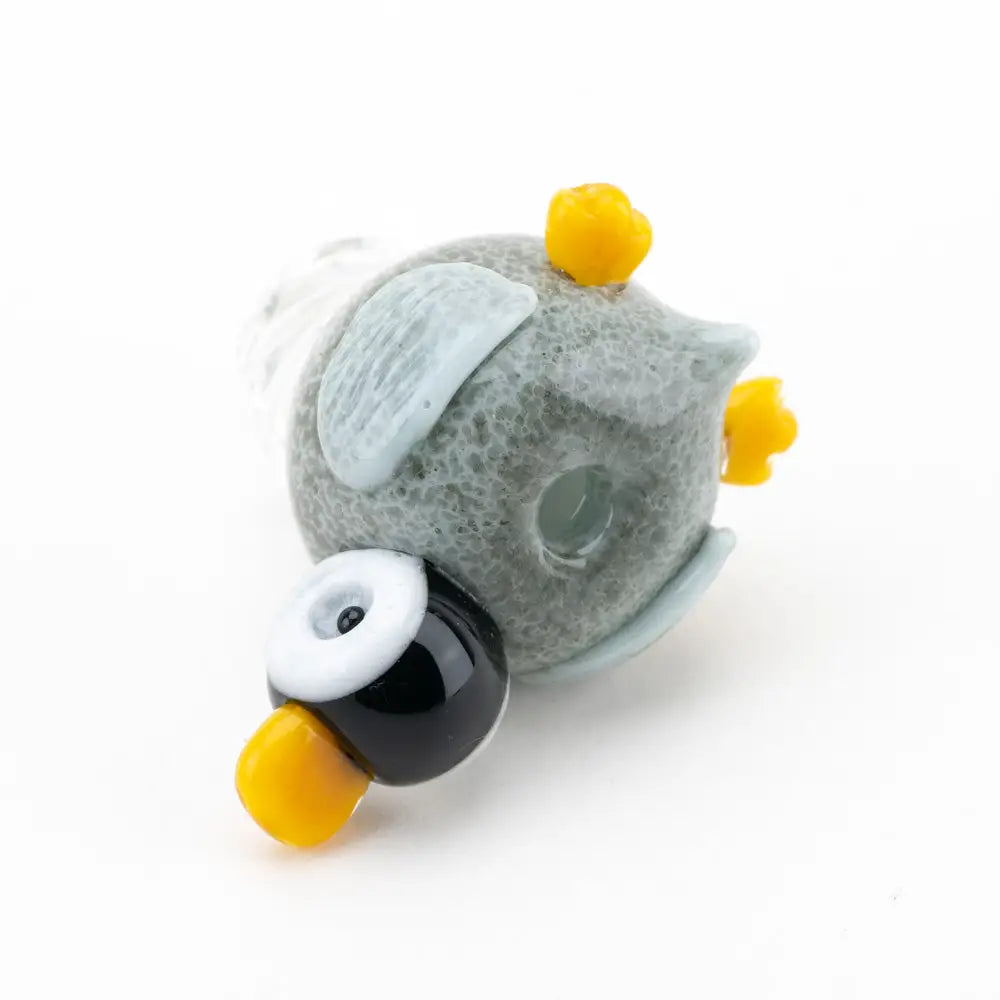 Empire Glassworks gray glass owl carb cap with yellow beak, black eye, blue wings
