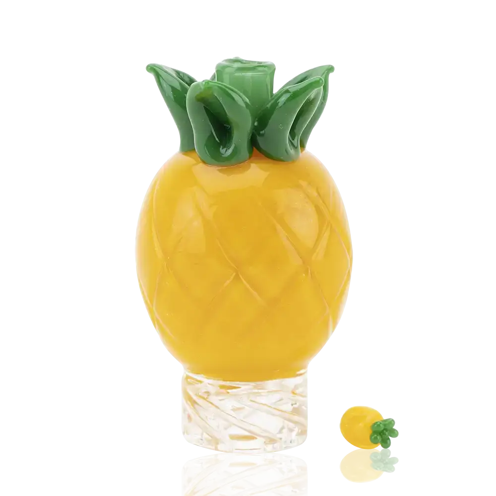 Empire Glassworks pineapple themed carb cap with yellow glass and green leafy top