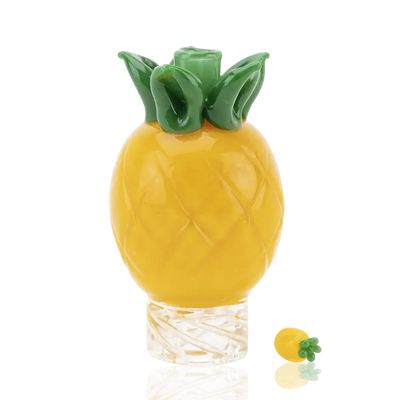 Empire Glassworks pineapple themed carb cap with yellow glass and green leafy top
