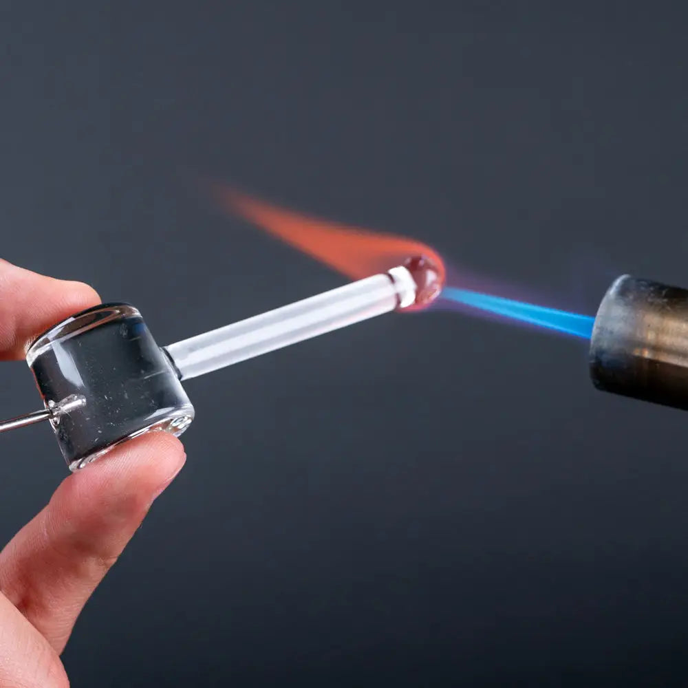 Empire Glassworks poker wand clear glass hand pipe heated by blue flame