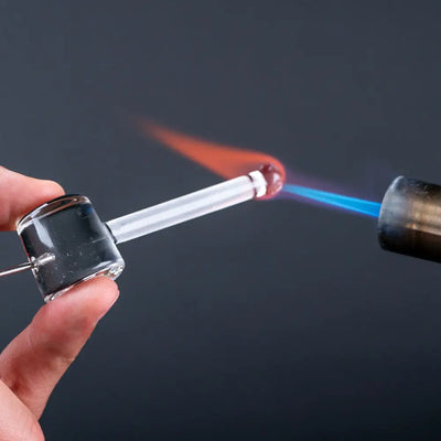 Empire Glassworks poker wand clear glass hand pipe heated by blue flame