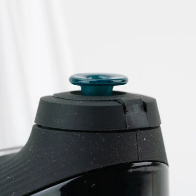 Black speckled Empire Glassworks Proxy Glass Joystick water bottle with teal cap