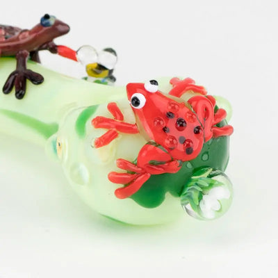 Empire Glassworks Ribbit glass spoon pipe with red frog on green pipe