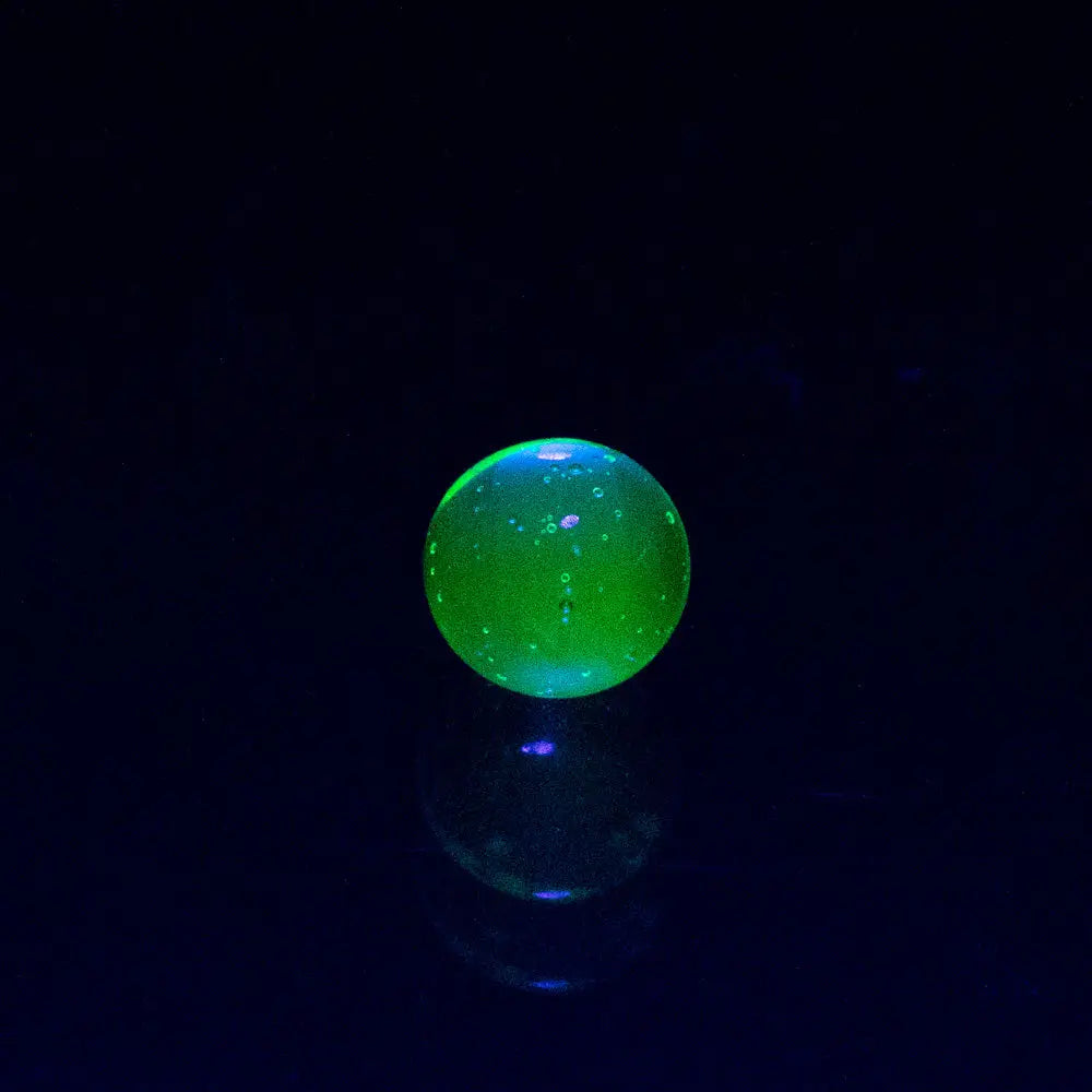 Glowing green Empire Glassworks spinner cap carb cap with bubbles