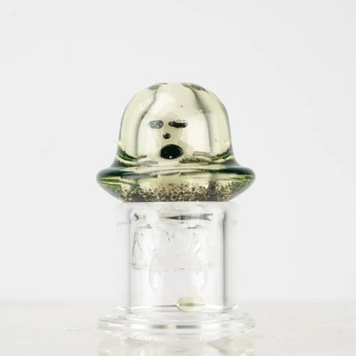 Empire Glassworks Spinner Cap Carb Cap with translucent green glass, cartoon face and speckled base