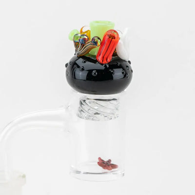 Empire Glassworks Spinner Cap Coral Reef Carb Cap with black textured glass and colorful accents