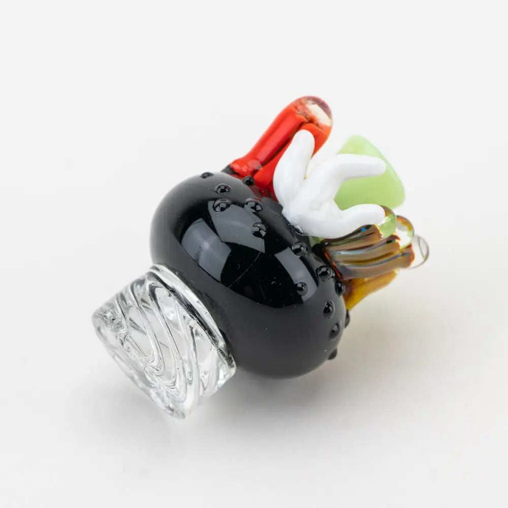 Empire Glassworks Spinner Cap Coral Reef Carb Cap with black glass pipe, clear textured base, and colorful fused accents in red, white, green, and amber