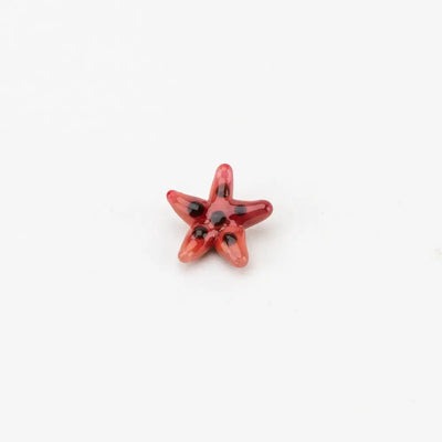 Glossy red Empire Glassworks spinner cap carb cap with starfish charm