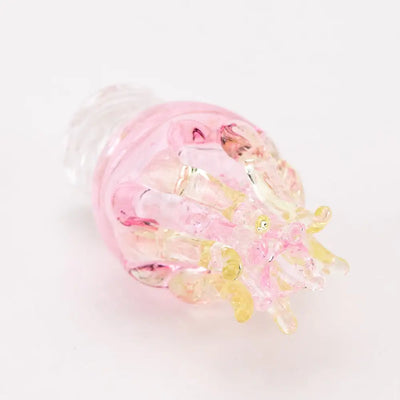 Delicate pink hermit crab glass figurine on Empire Glassworks spinner cap carb cap