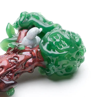 Empire Glassworks hand pipe with jade dragon carving and white snail on red branch