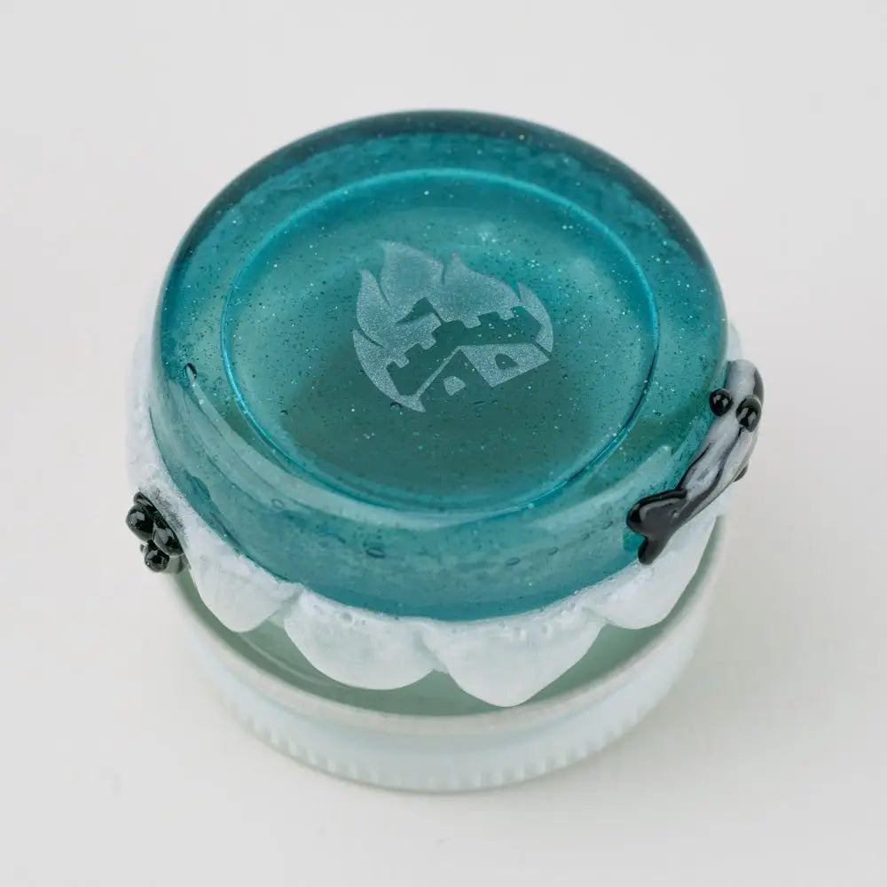 Empire Glassworks Avenge the Arctic terp jar with teal translucent glass