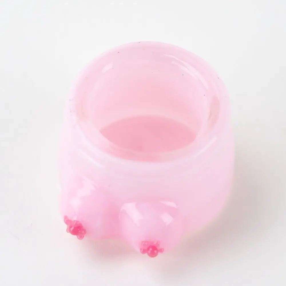 Pink translucent Empire Glassworks terp jar with boobies protrusions