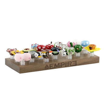 Colorful hand-blown glass bowl pieces in Empire wooden bowl piece display