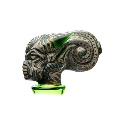 Green and grey carved glass sculpture resembling a horned creature’s head on Etch Dab Rig V2