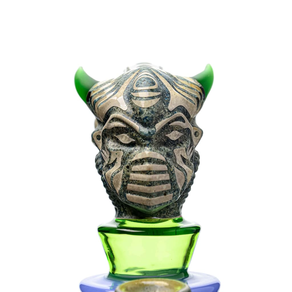 Ornate bottle stopper with green-horned tribal mask for Etch Dab Rig V2 with Slitted Cut Perc