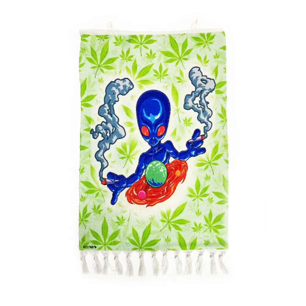 Green tapestry with blue alien smoking cannabis leaves on Cosmic Alien Glass Pipe