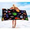 Colorful Alien Leaf Beach Towel With Food And Text Designs On a Black Background