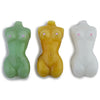 Three female body glass pipes in green, yellow, and white on display from Milky Hues collection