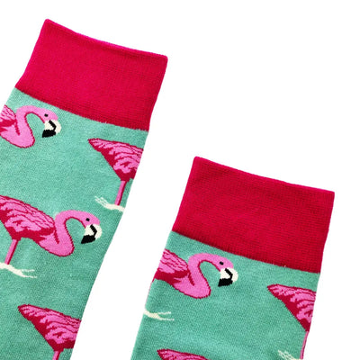 Mint green flamingo socks with pink pattern and red trim for a stylish fit