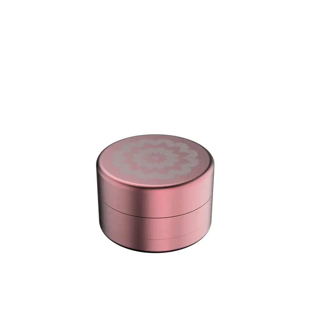 Rose gold cosmetic container with Flower Mill’s Generation Standard glass hand pipe design