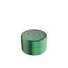 Green metal grinder featuring floral design for Flower Mill’s Generation Standard rolling paper