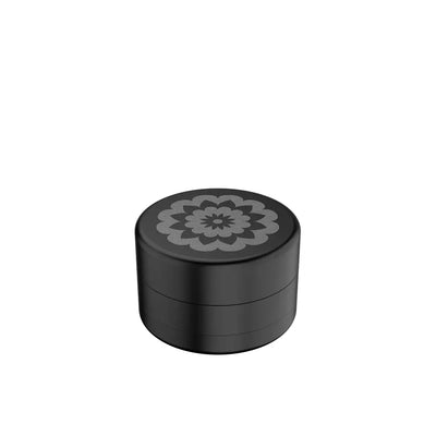 Black cylindrical container with floral design for Flower Mill’s Generation Standard glass hand pipe