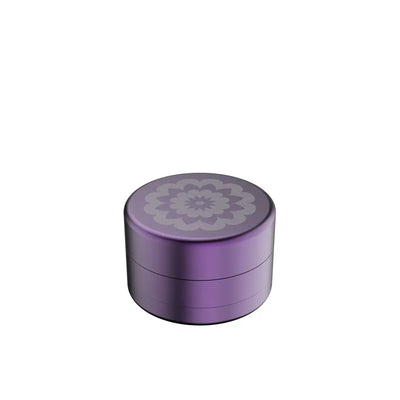 Purple metal grinder with floral design for Flower Mill’s Generation Standard rolling papers