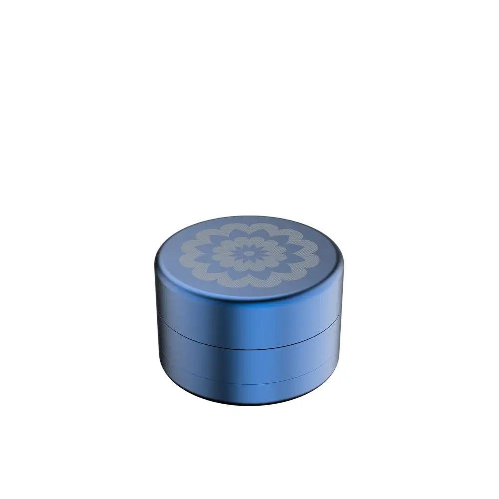 Blue metal grinder with floral design for Flower Mill’s Generation Standard rolling papers