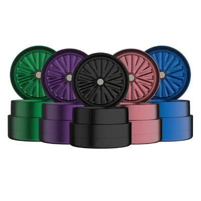 Colorful metal herb grinders with Flower Mill’s Generation Standard rolling paper design