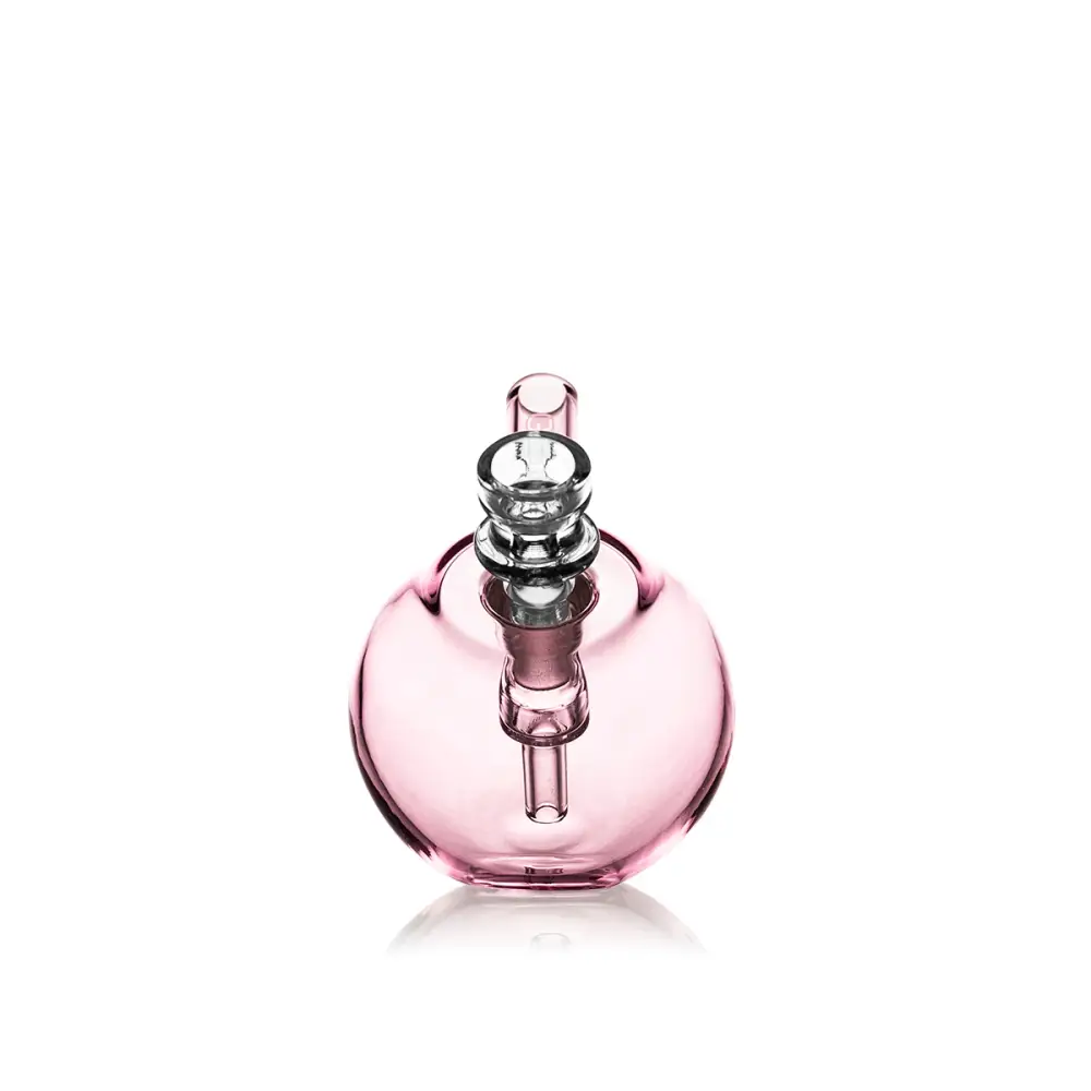 Pink glass water pipe featuring the Grav Spherical Pocket Bubbler for on-the-go use